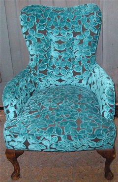Chair upholstered in designer fabric